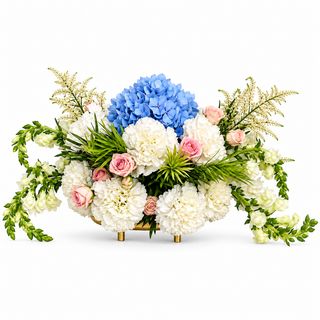 Low floral centerpiece with blue hydrangeas, white flowers, pink roses and greenery.
